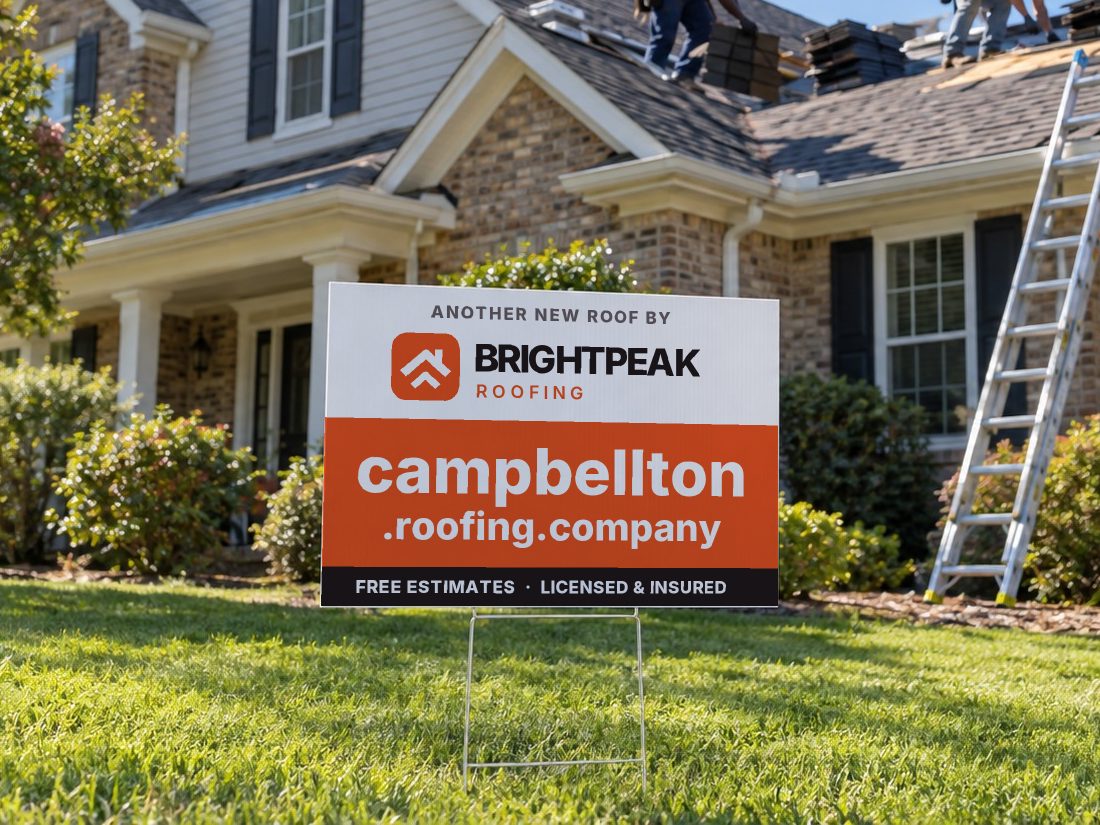 campbellton.roofing.company on a yard sign in front of a house getting a new roof
